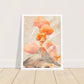 Volcano with orange smoke art print in a white wood frame, 45x60 cm