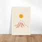 Orange sun over red mountain art print in a light wood frame, 60x90 cm