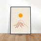 Orange sun over red mountain art print in a black wood frame, 45x60 cm